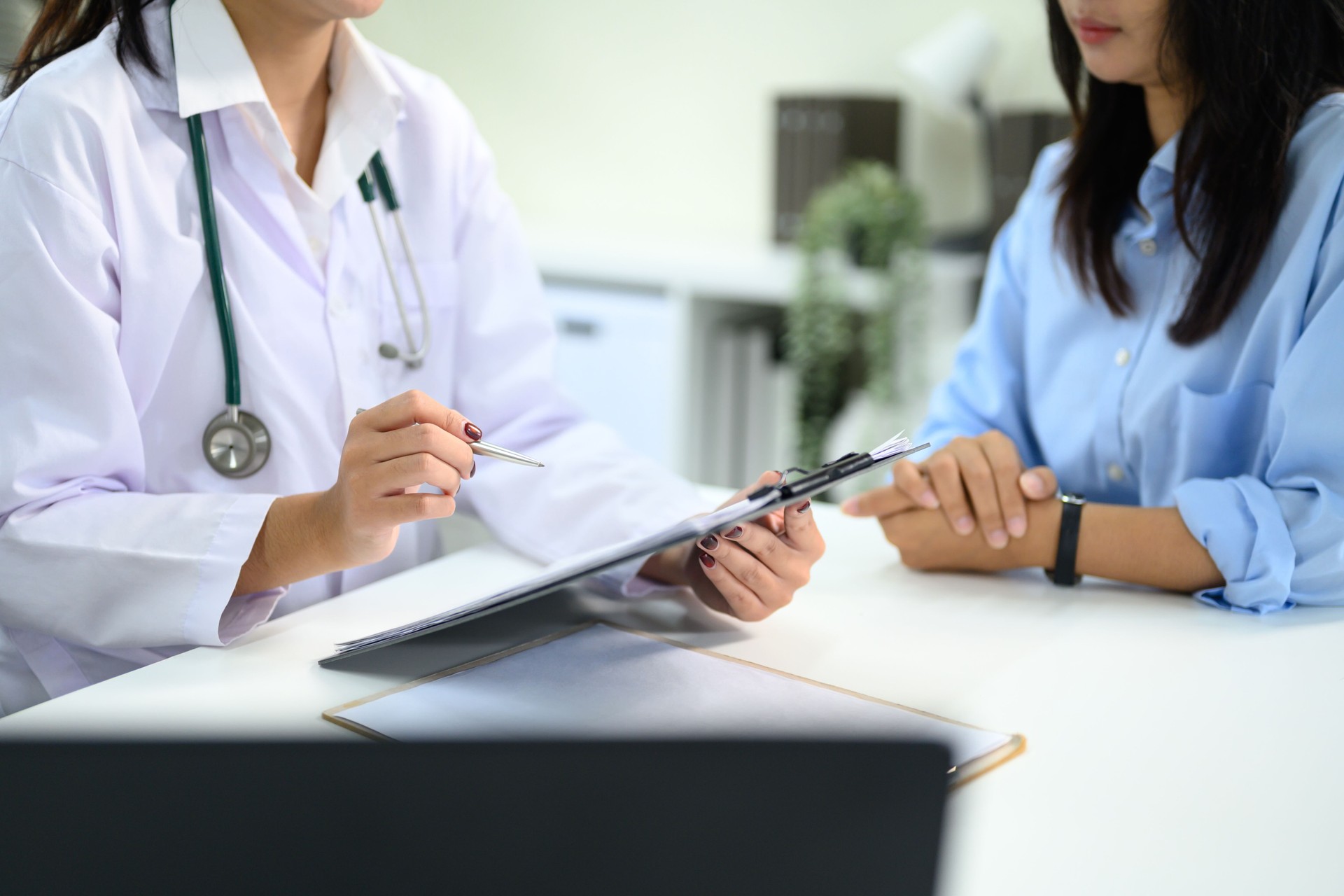 Doctor discussing medical results with patient in office